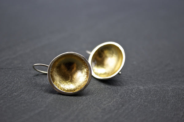 Earrings with silver and gold leaf dome