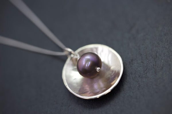 Pendant with domed disc and pearl