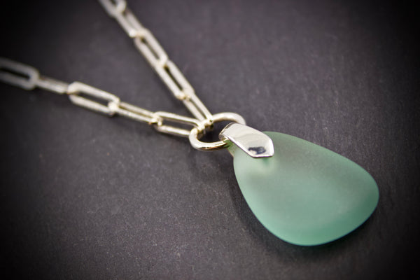 Necklace with sea glass pendant on silver square chain