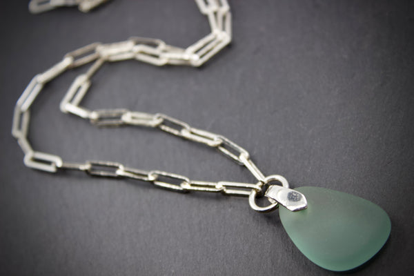 Necklace with sea glass pendant on silver square chain