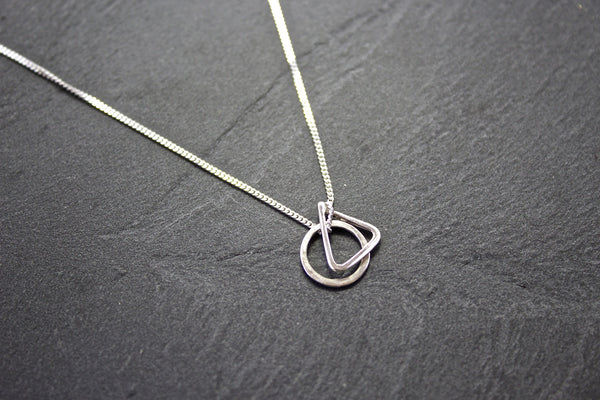 Pendant with circle and triangle