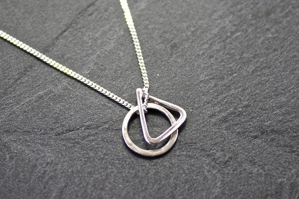 Pendant with circle and triangle