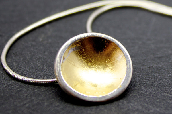 Pendant with small silver and gold leaf dome