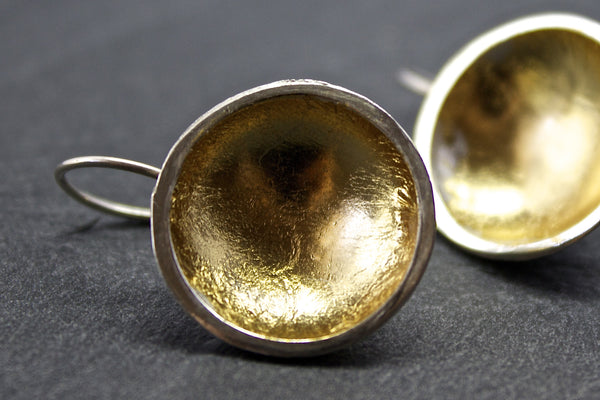 Earrings with silver and gold leaf dome