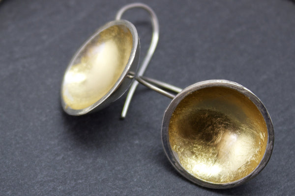 Earrings with silver and gold leaf dome