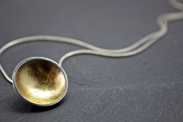 Pendant with large silver and gold leaf dome