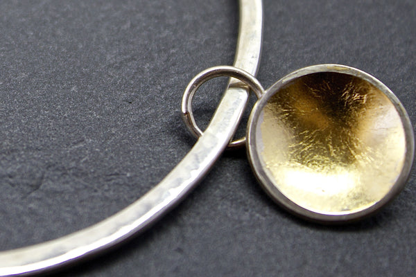 Bracelet with silver and gold leaf dome