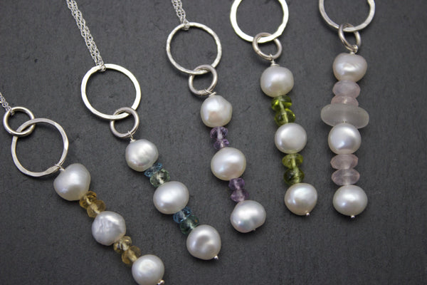 Pendant with a column of freshwater pearls and semi-precious stones.