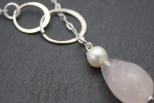 Necklace with circle loop and rose quartz drop