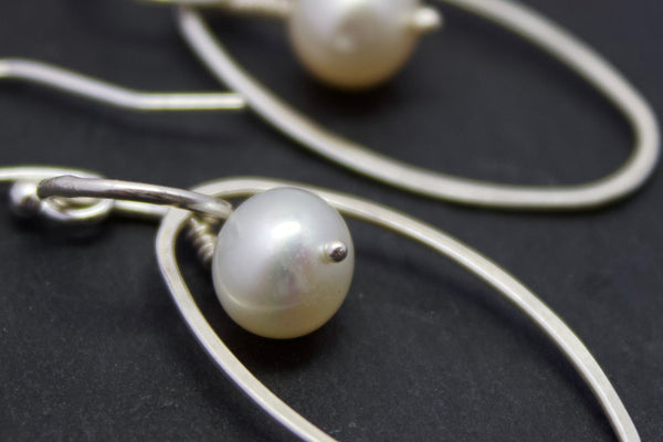 Earrings with oval and freshwater pearl drop