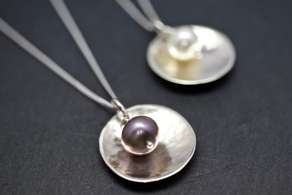 Pendant with domed disc and pearl