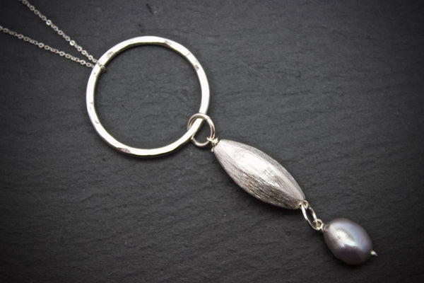 Pendant with brushed silver and pearl