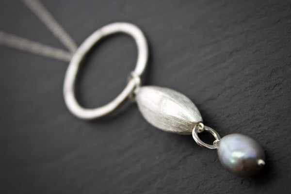 Pendant with brushed silver and pearl