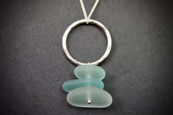 Pendant with hammered circle and stacked sea glass