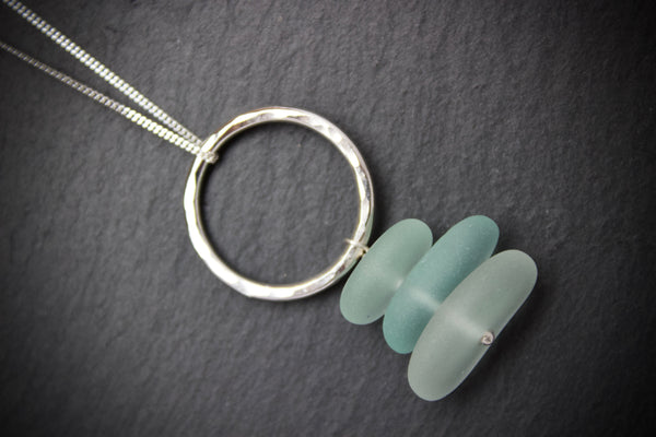 Pendant with hammered circle and stacked sea glass