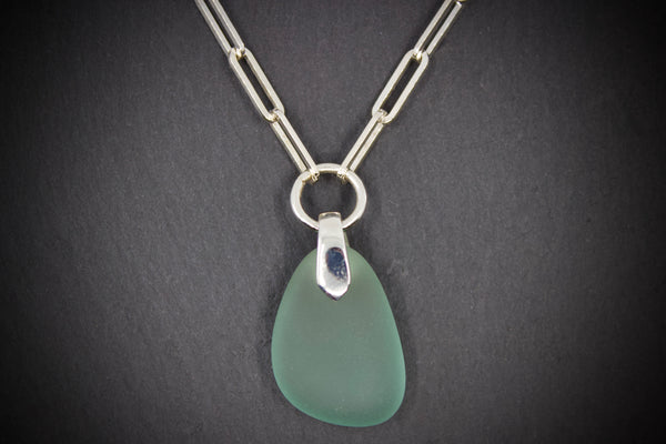 Necklace with sea glass pendant on silver square chain