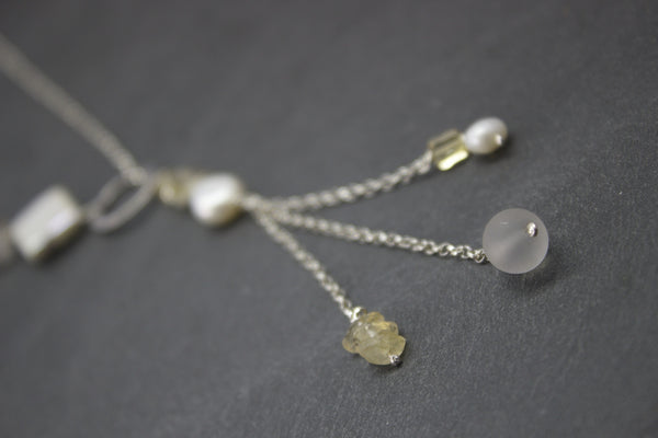 Pendant with citrine and three strand chains